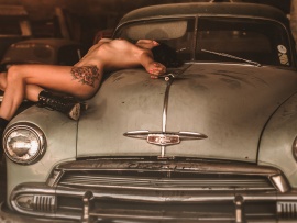 Nude inked babe and Chevy (click to view)